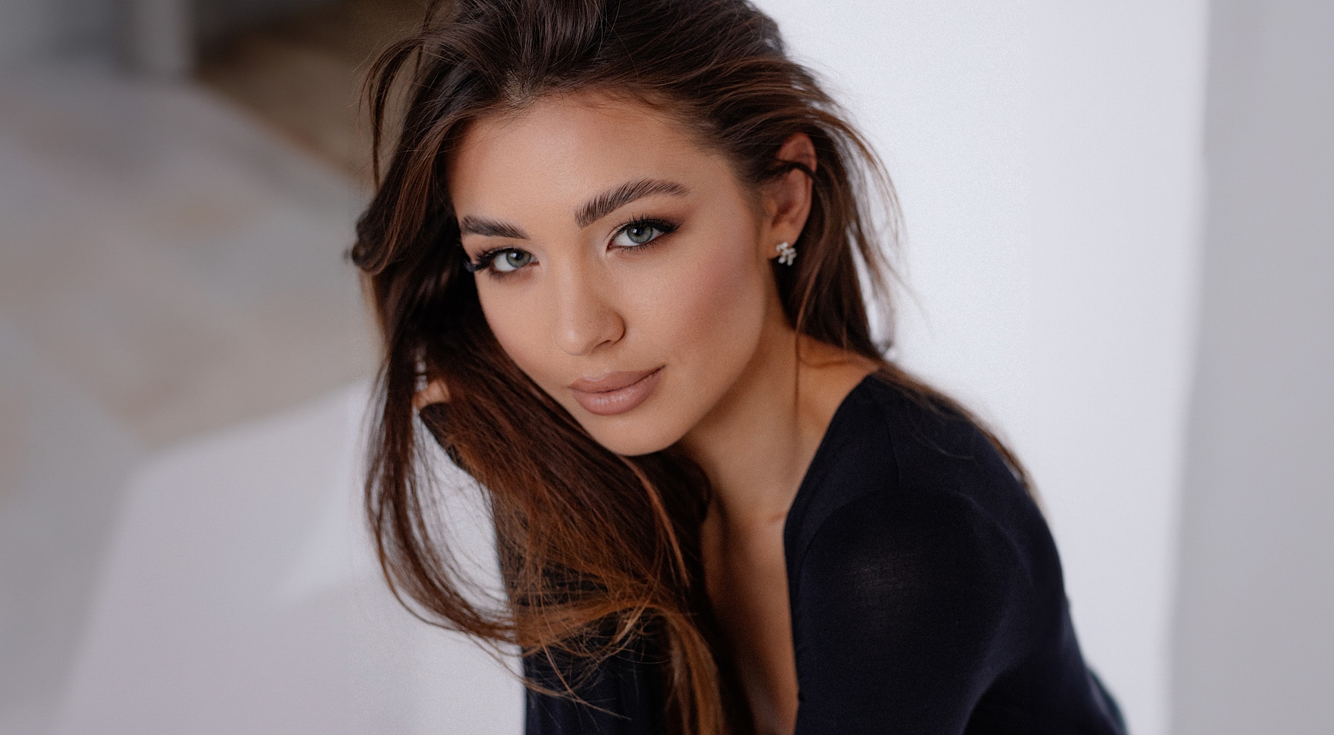 Portrait of a woman with long hair.